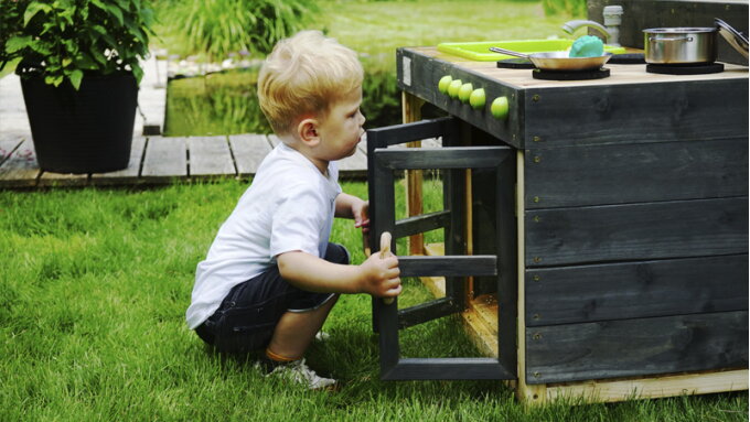 Cooking with whatever nature has to offer in an outdoor play kitchen