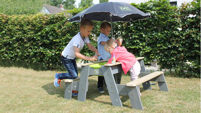 Playing outside in a small garden with EXIT Toys